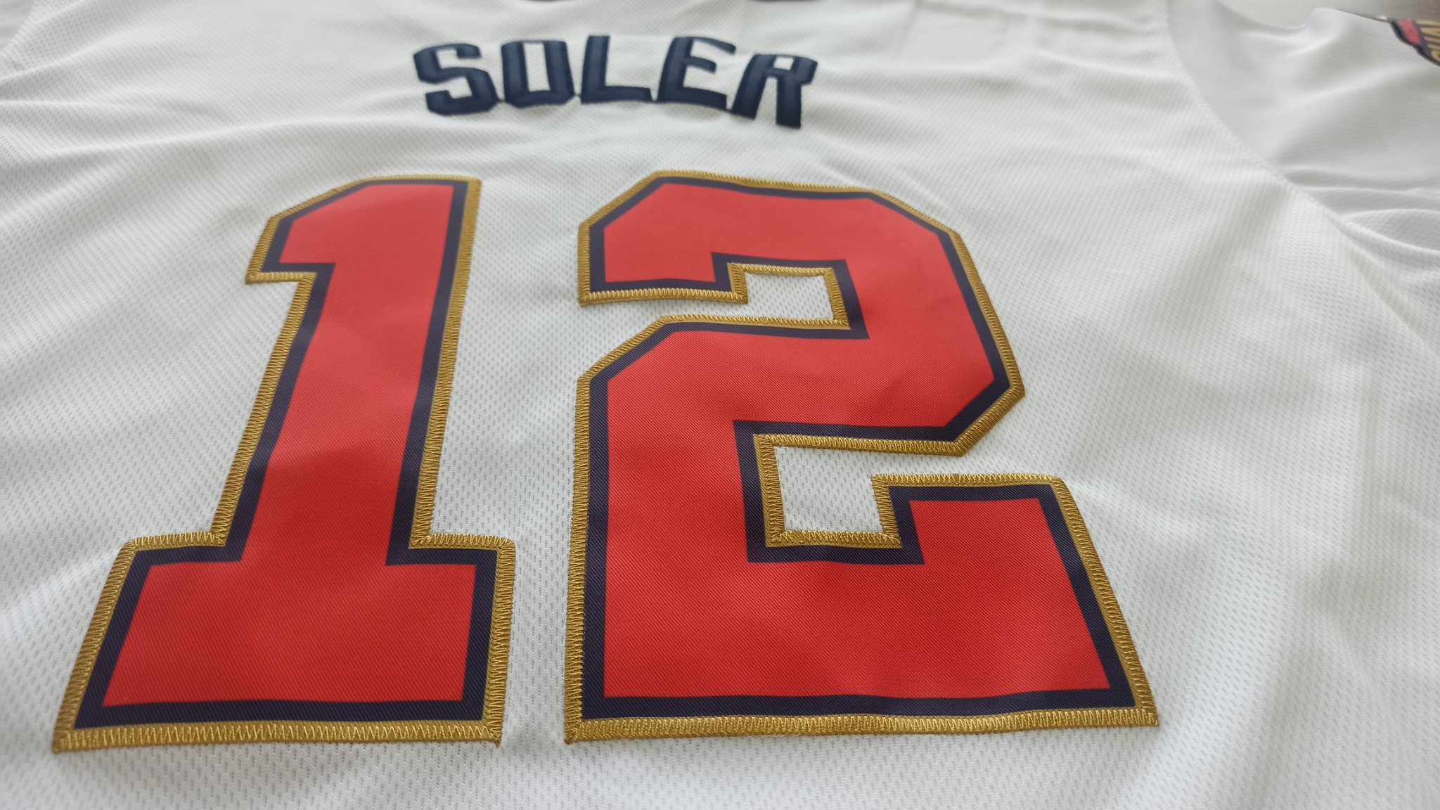 A micro shot of the breathable, high-performance fabric of a Ujersey Shop product